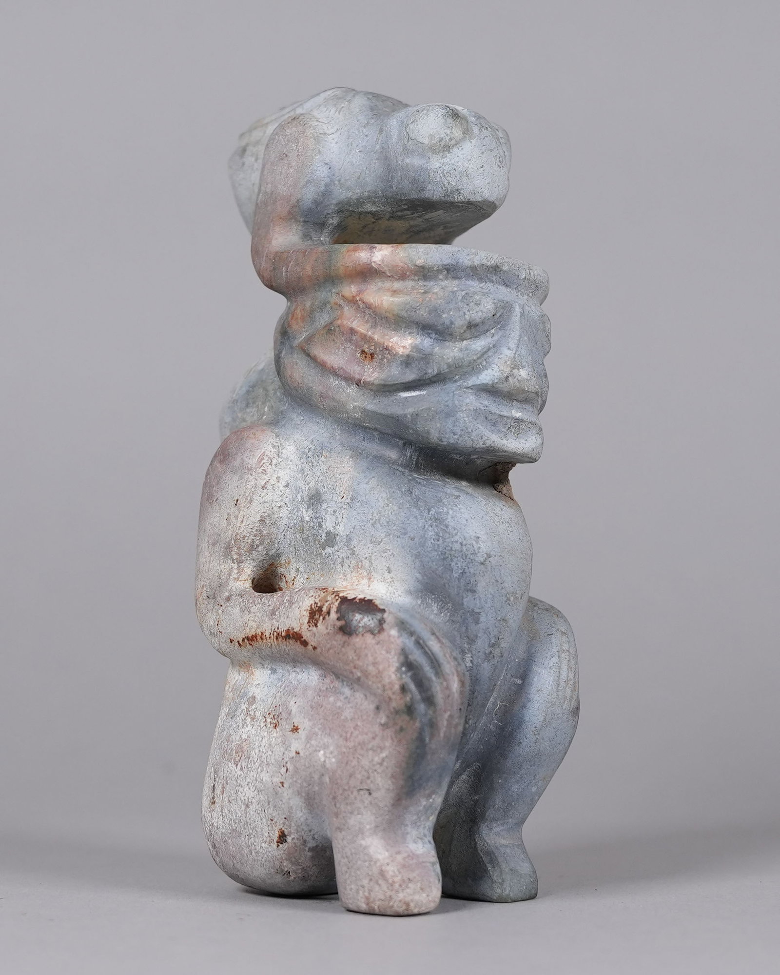 An unusual stone carved item: An unusual stone carved item. H: 8" x W: 3.5."