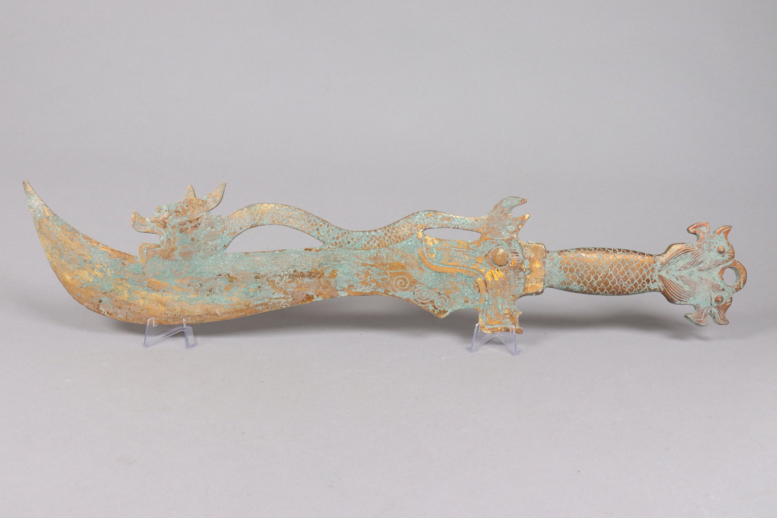 Chinese large gilted bronze sword: Chinese large gilted bronze sword. H: 4.5 x L: 24."