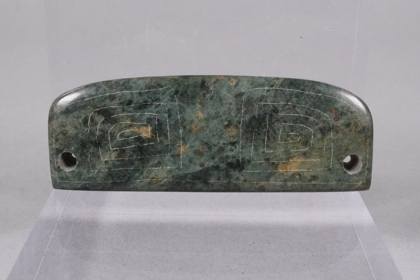 A fine green jade carved celt: A fine green jade carved celt.