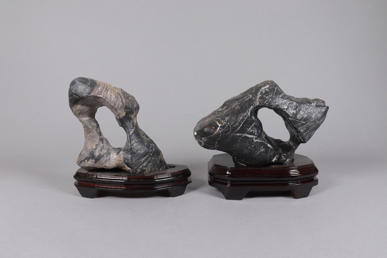 2 Chinese scholar stone with stand: 2 Chinese fine heavy scholar stones with wooden stand.