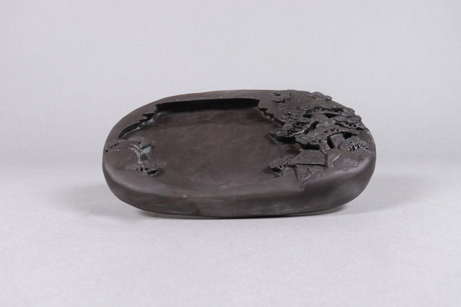 Chinese finely carved ink stone: Chinese finely carved ink stone. H: 1.15" x W: 8."