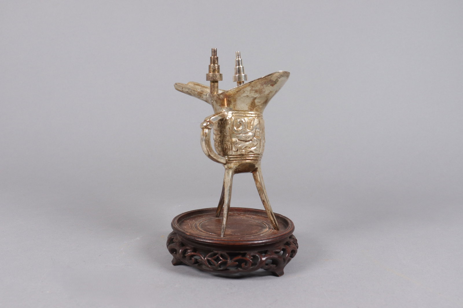 A Chinese style brass cup: A Chinese style brass cup. H: 6.5" x W: 5.1."
