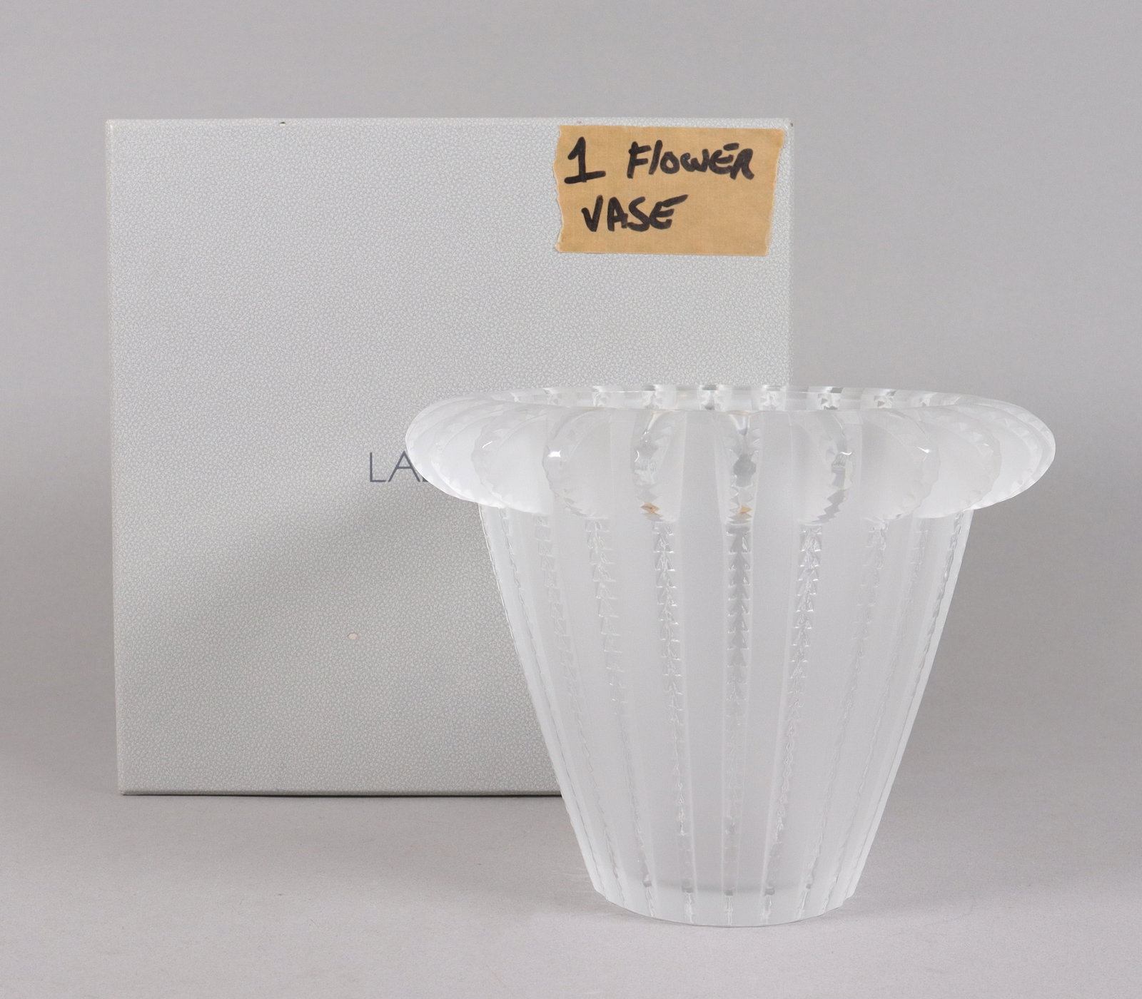 A fine Lalique crystal fine pot: A fine Lalique large crytal fine pot with original box. H: 6.5" x W: 8."