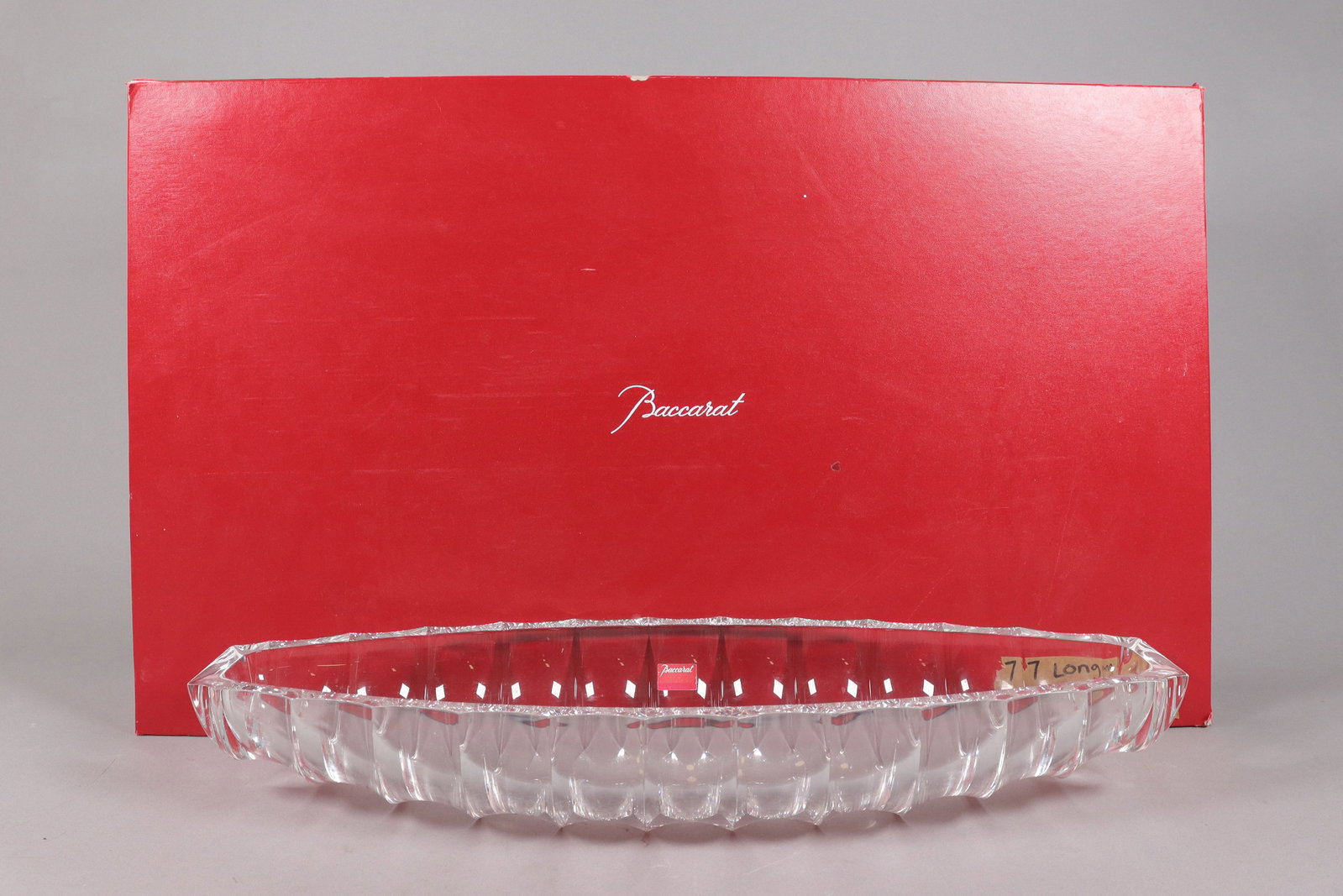 A large Baccarat fine crystal plate: A large Baccarat fine crystal plate with original box. H: 3.5" x W: 23.5."