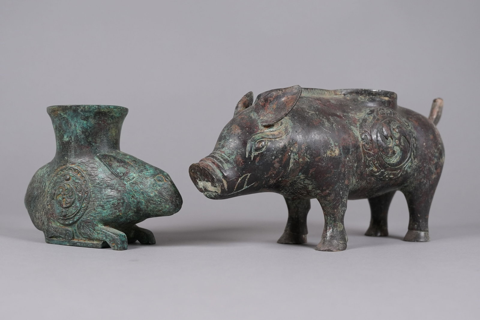 2 Chinese bronze finials: 2 Chinese bronze finials. Largest H: 5.8" x W: 12.1."
