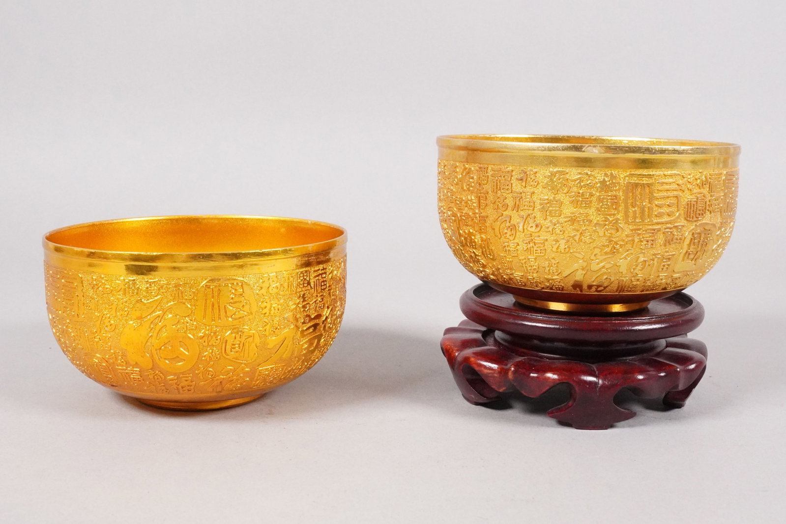 2 Chinese gilted bowls: 2 Chinese fine gilted bowls. Largest H: 2.5" x W: 4.2."