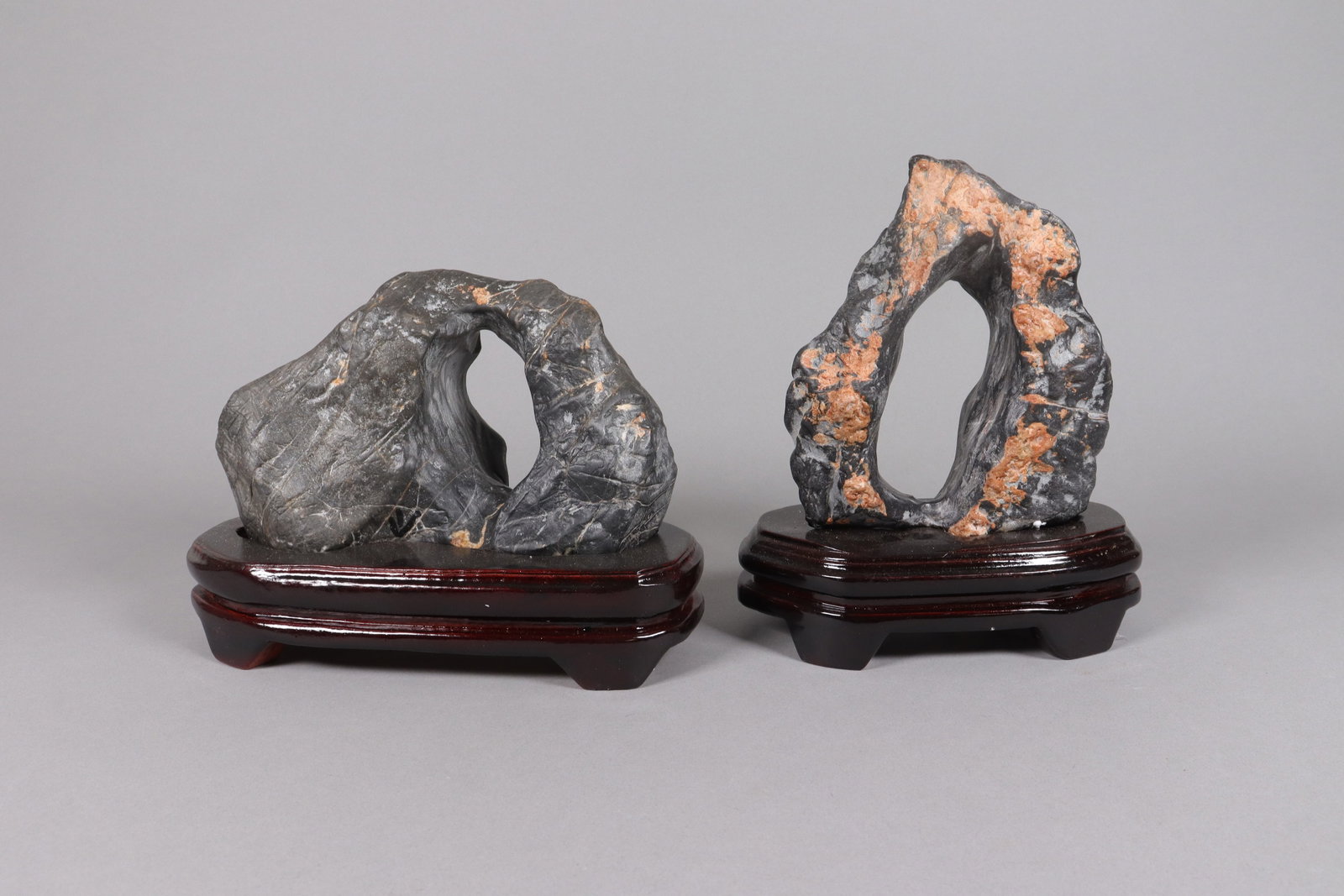 2 Chinese scholar stones on stand: 2 Chinese scholar stones on wooden stand. Heavy in weight.