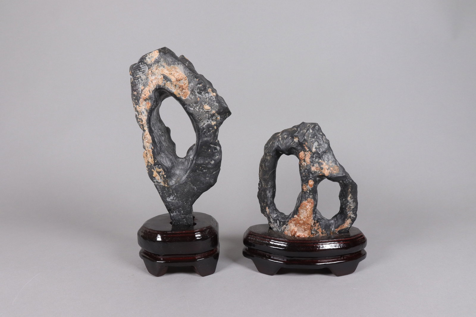 2 Chinese scholar stones on stand: 2 Chinese scholar stones on wooden stand. Heavy in weight.
