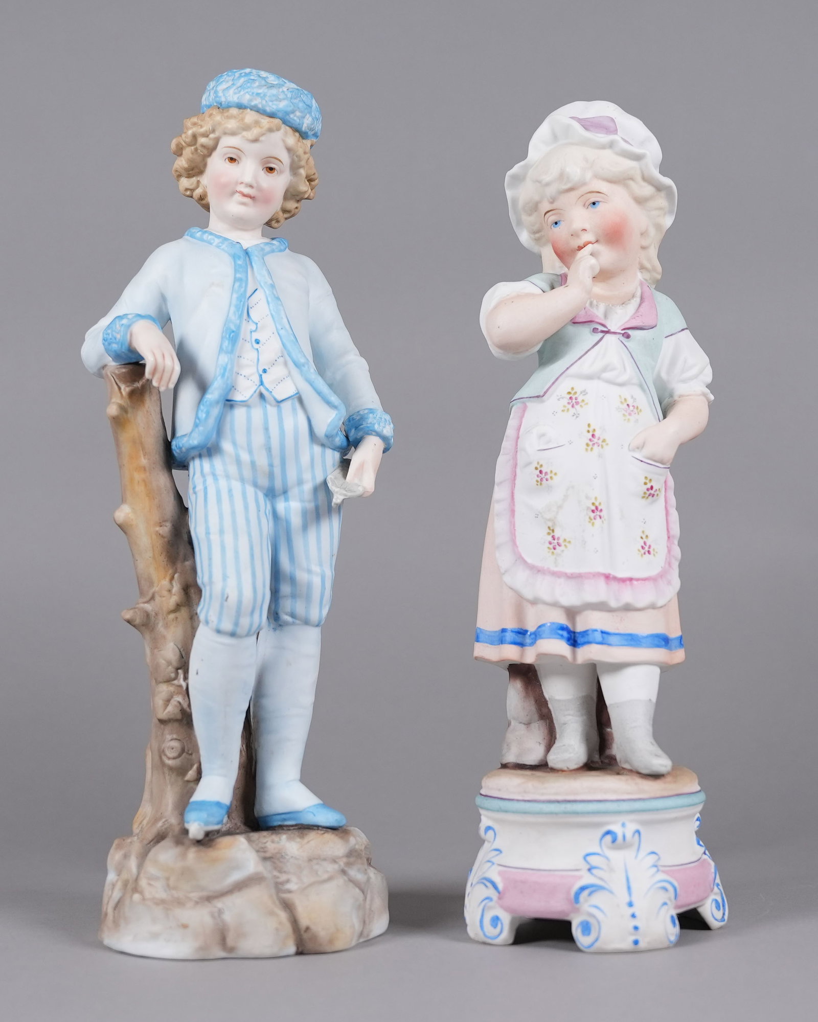 2 antique European porcelain figurine: 2 antique European porcelain figurines. H: 13" x W: 4.2."