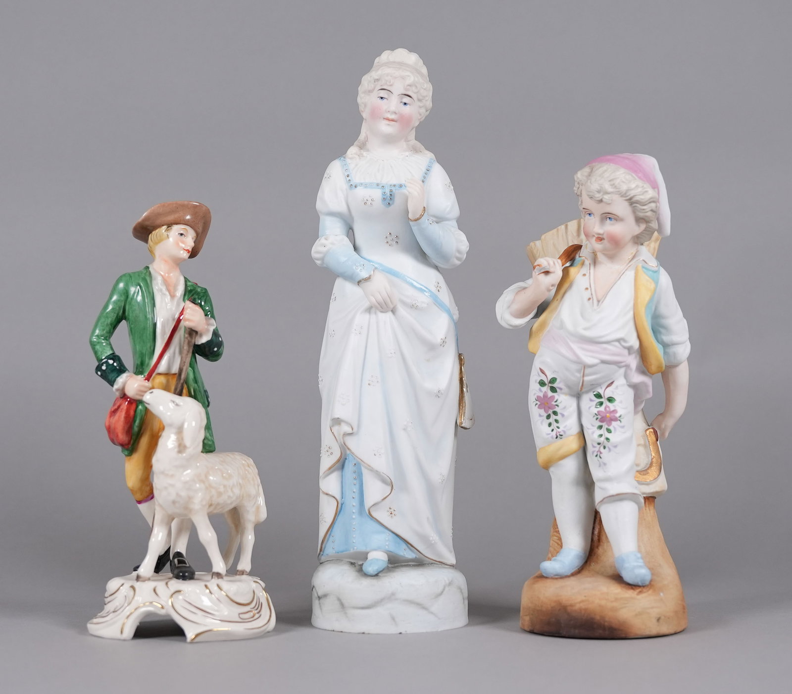 3 vintage European porcelain figurine: 3 vintage European fine porcelain figurines. Largest H: 12.2" x W: 3.1."