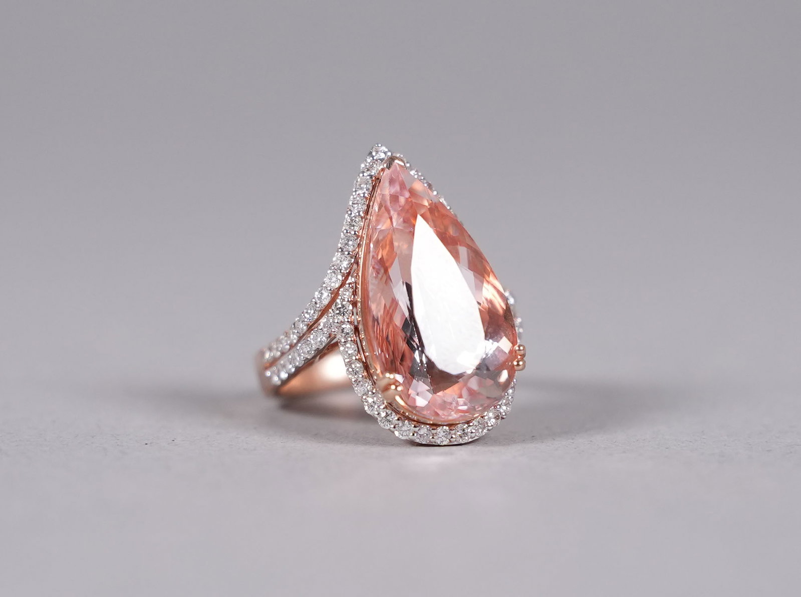 14 kt two tone gold morganite diamond ring: 14 kt two tone gold natural morganite and diamond ring. Total 11.94 carats natural morganite and total 0.95 carats natural diamonds. US ring size 7.75.