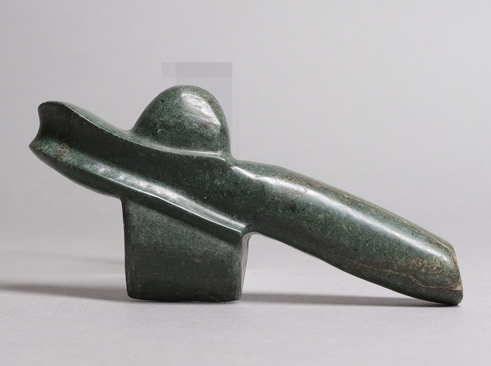 Pre-Columbian jade carved celt estate: Pre-Columbian fine jade carved celt, from a major estate. H: 3" x W: 5.25."