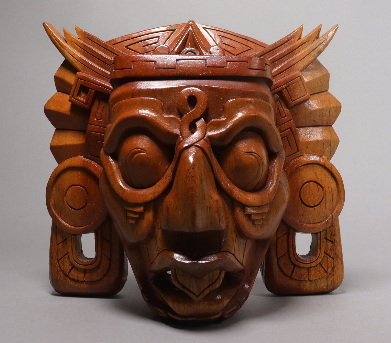 A vintage tribal mask: A vintage tribal mask, woode carved. H: 11.5" x W: 12."