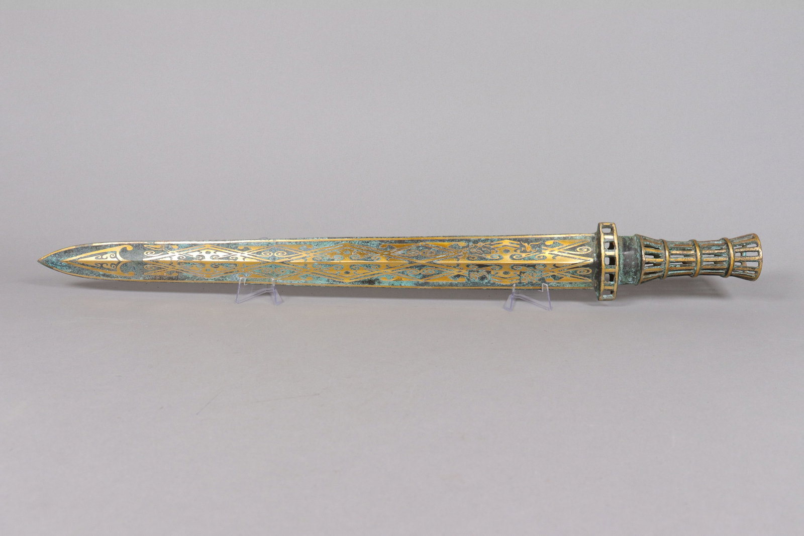 Chinese long gilted bronze sword: Chinese long gilted bronze sword. L: 25.1" x W: 3.15."