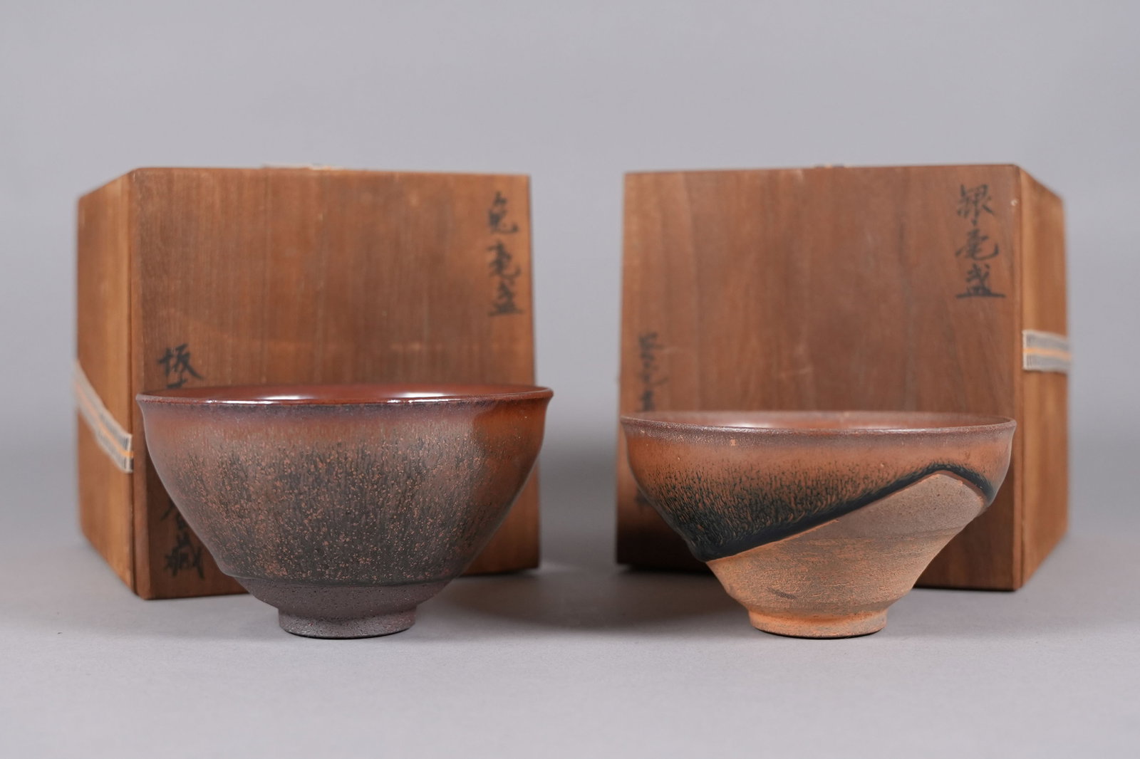 2 Chinese fine tea bowlsl with wooden box: 2 Chinese fine tea bowls with wooden box. H: 2.9" x W: 5."