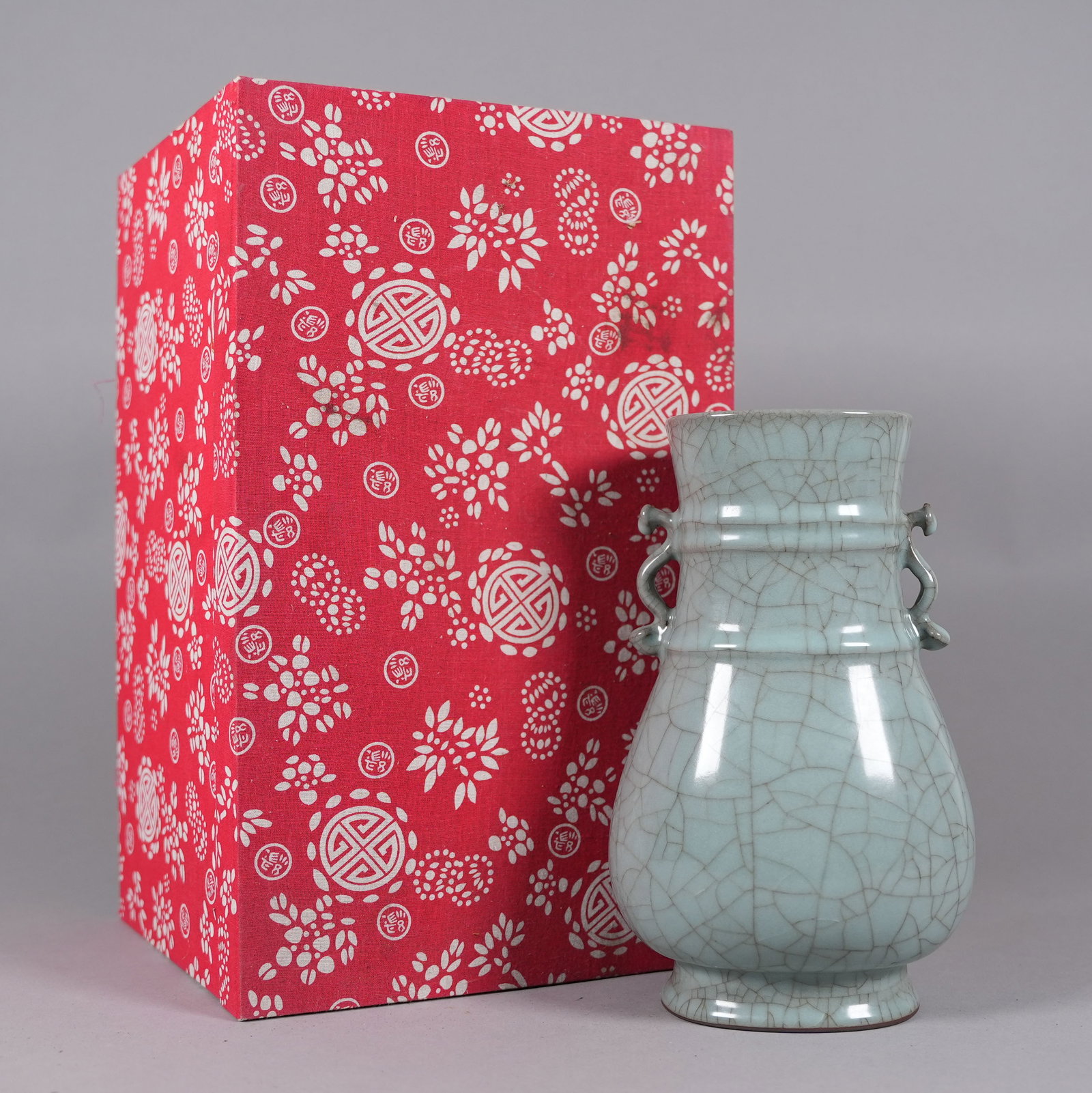 Chinese fine crackeled vase with heavy silk box: Chinese fine crackled vase with heavy silk box. H: 9.3" x W: 5.5."