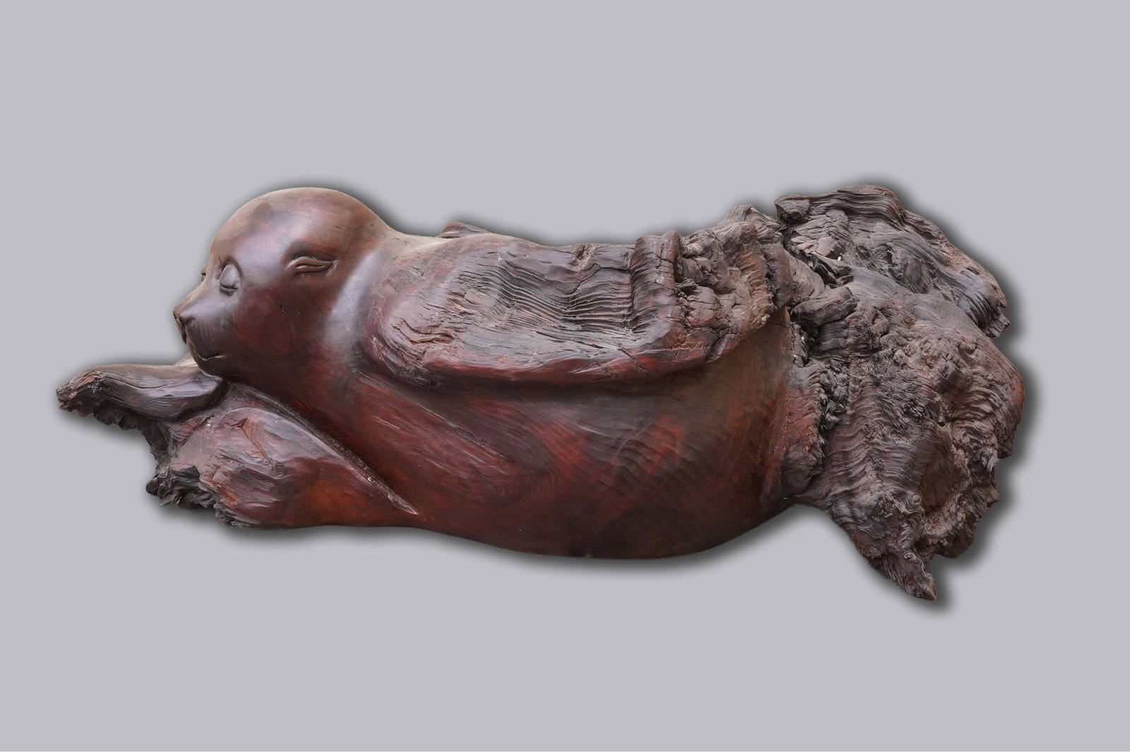 A vintage burl wood carved sculpture dated: A vintage burlwood fine vintage carved sculpture, and dated. H: 10" x W: 27."