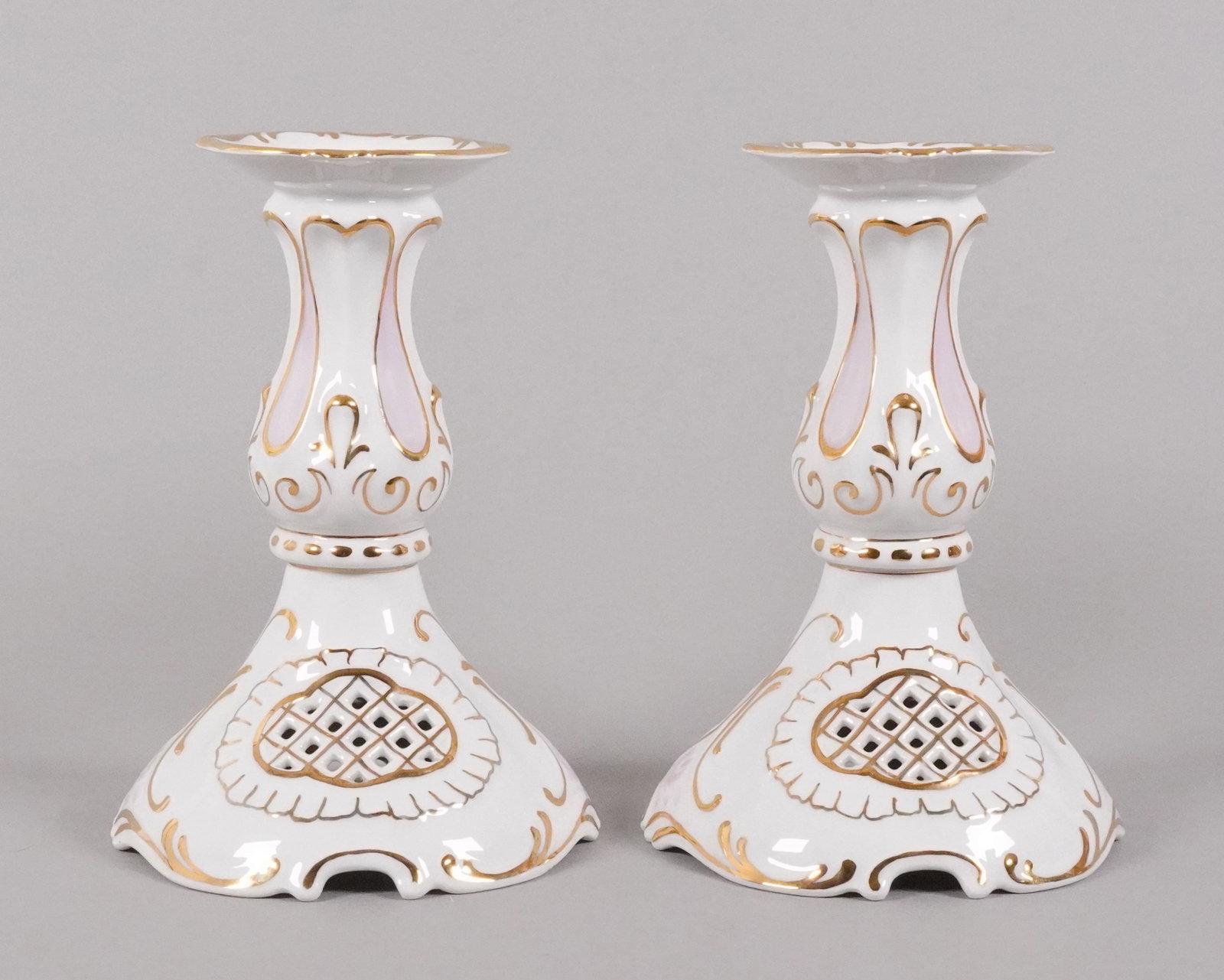 Lots porcelain candle stick: Lots porcelain candle sticks. Largest H: 8" x W: 6."