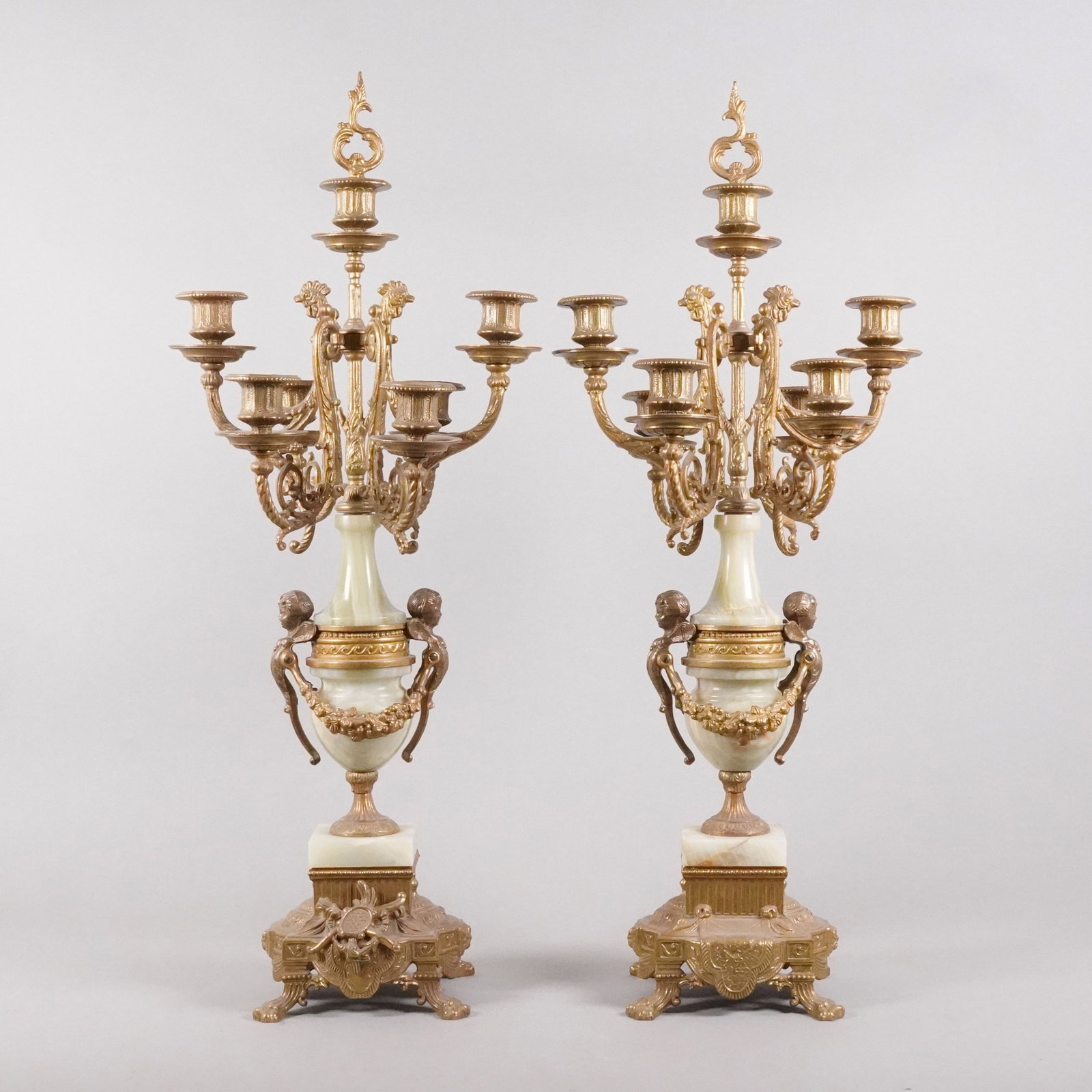 2 Italian antique candle holder: 2 Italian antique brass candle holder. H: 28" x W: 11."