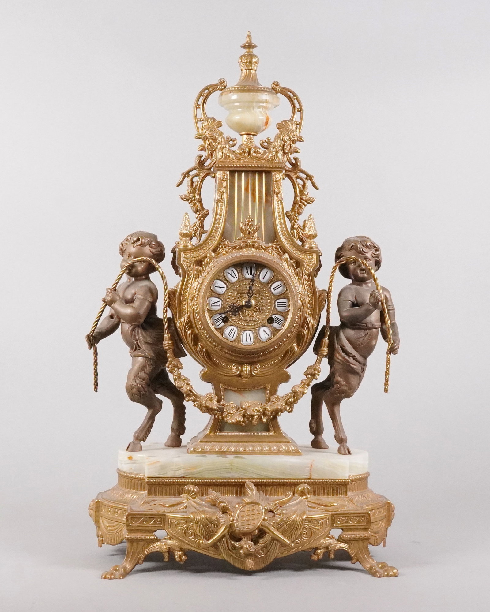 Antique German brass mantle clock: Antique German brass mantle clock, condition selling it as is. H: 25" x W: 15. Heavy in weight.