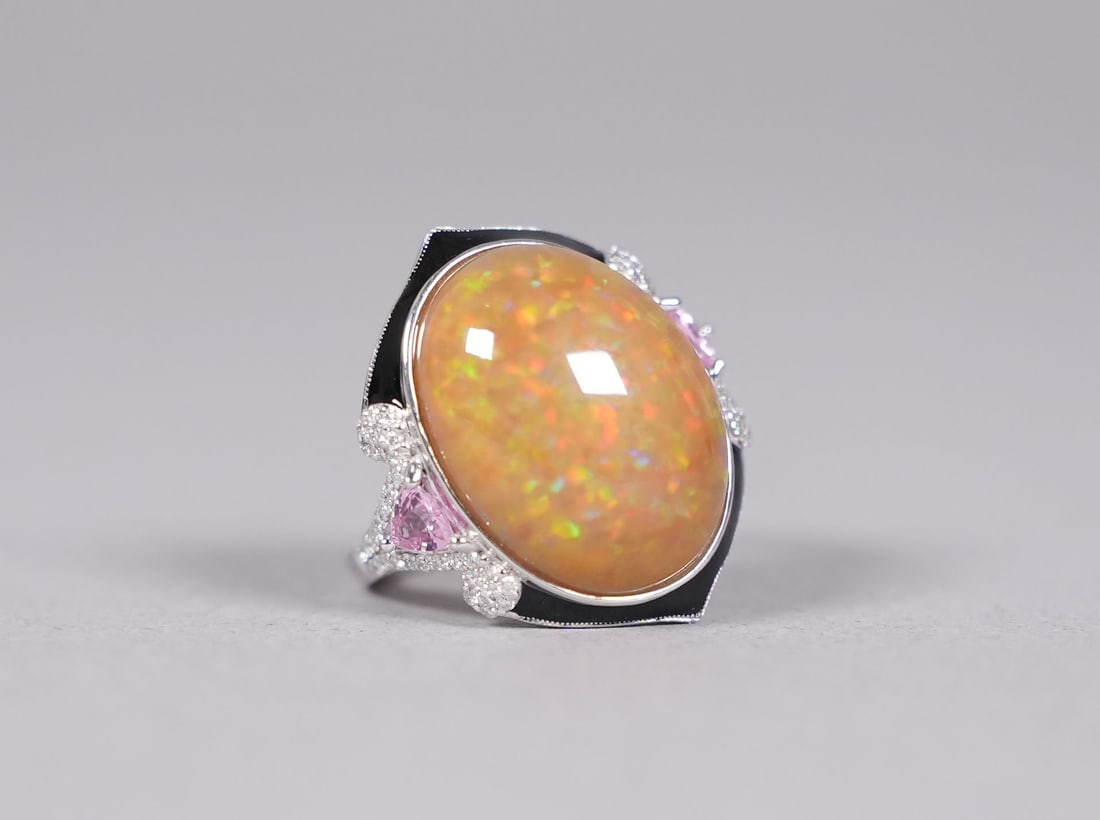 Platinum natural opal diamond ring: Platinum natural opal and diamond ring. Total 12.30 natural carats opal and total 0.32 carats natural diamonds. US ring size 7.2.