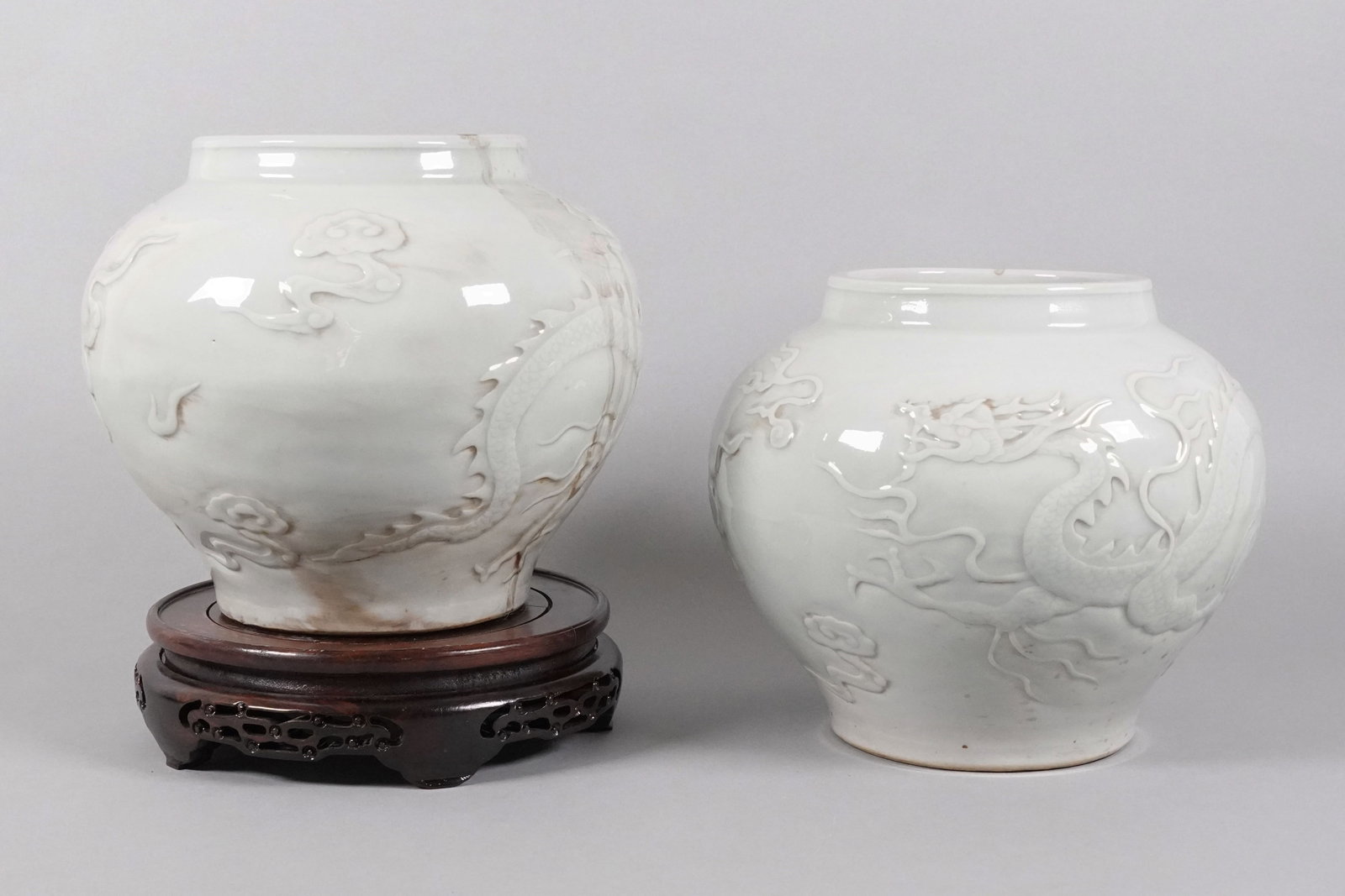 2 Chinese white jars: 2 Chinese white jars, largest H: 8.75" x W: 10.15."