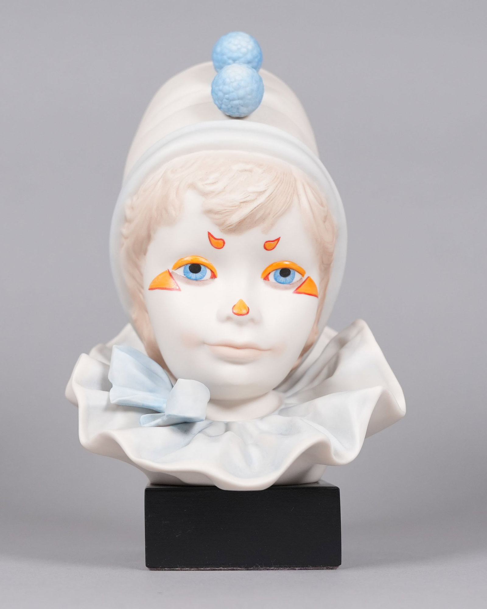 A vintage Jester porcelain figurine signed: A vintage Jester porcelain figurine, signed. H: 9.5" x W: 5.6."