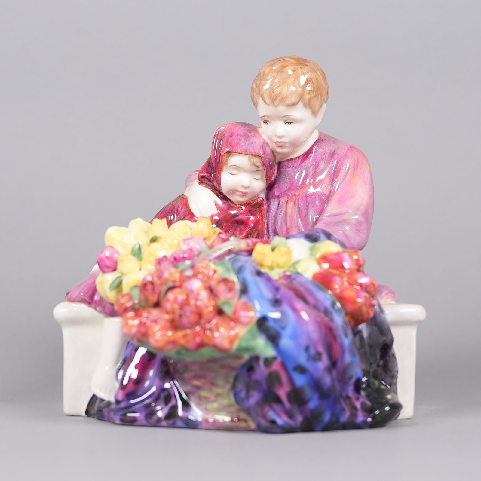 A vintage porcelain figurine: A vintage porcelain figurine, marked. H: 7.7" x W: 7."
