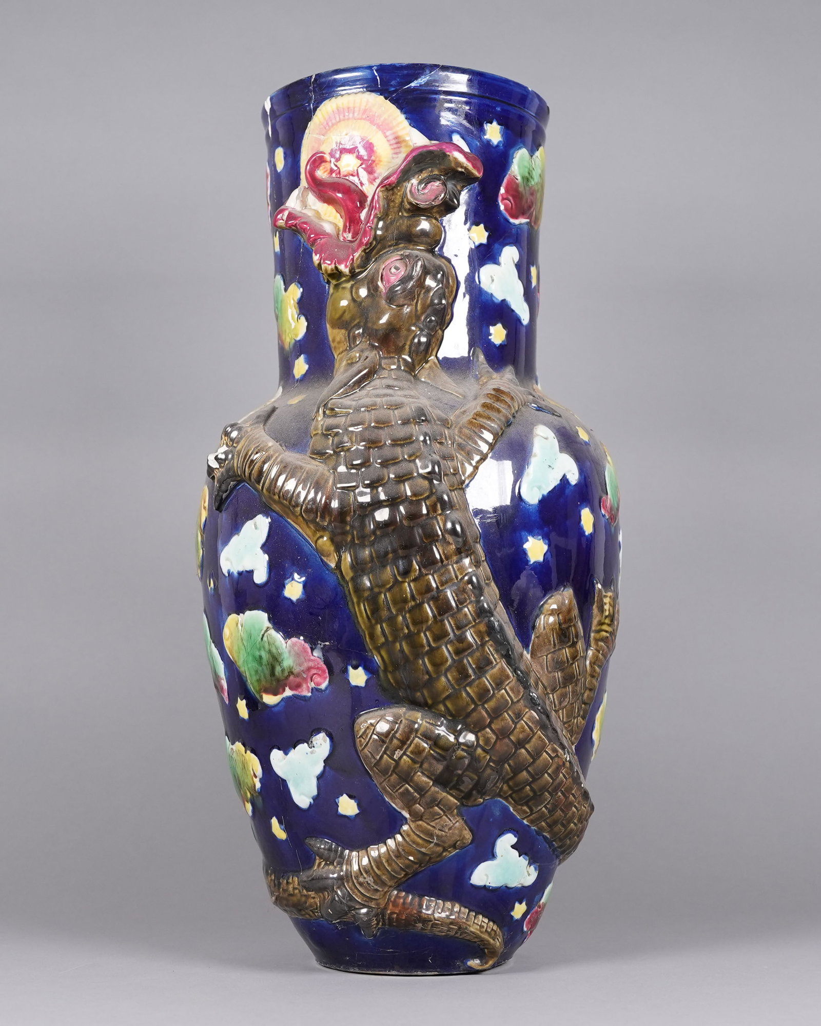 A large jug: A large jug, damaged. Please refer to detail photos. All sales are final, no return. H: 22" x W: 11.5."
