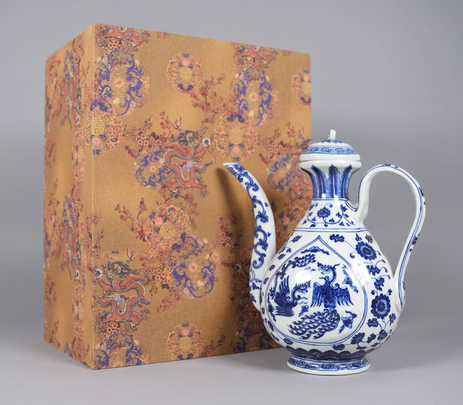 Chinese fine pitcher in heavy silk box: Chinese fine pitcher in heavy silk box. H: 10.5" x W: 9.2."