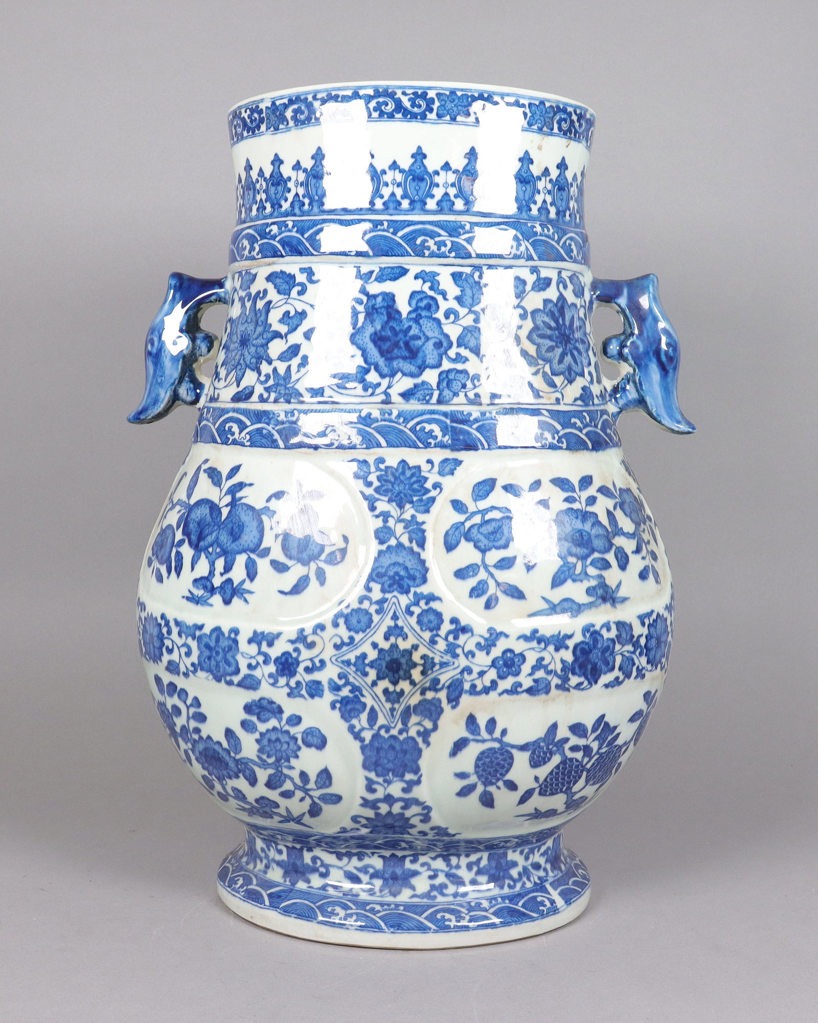 Chinese tall handled b/w vase: Chinese tall fine handled blue and white vase. H: 19.25" x W: 13."