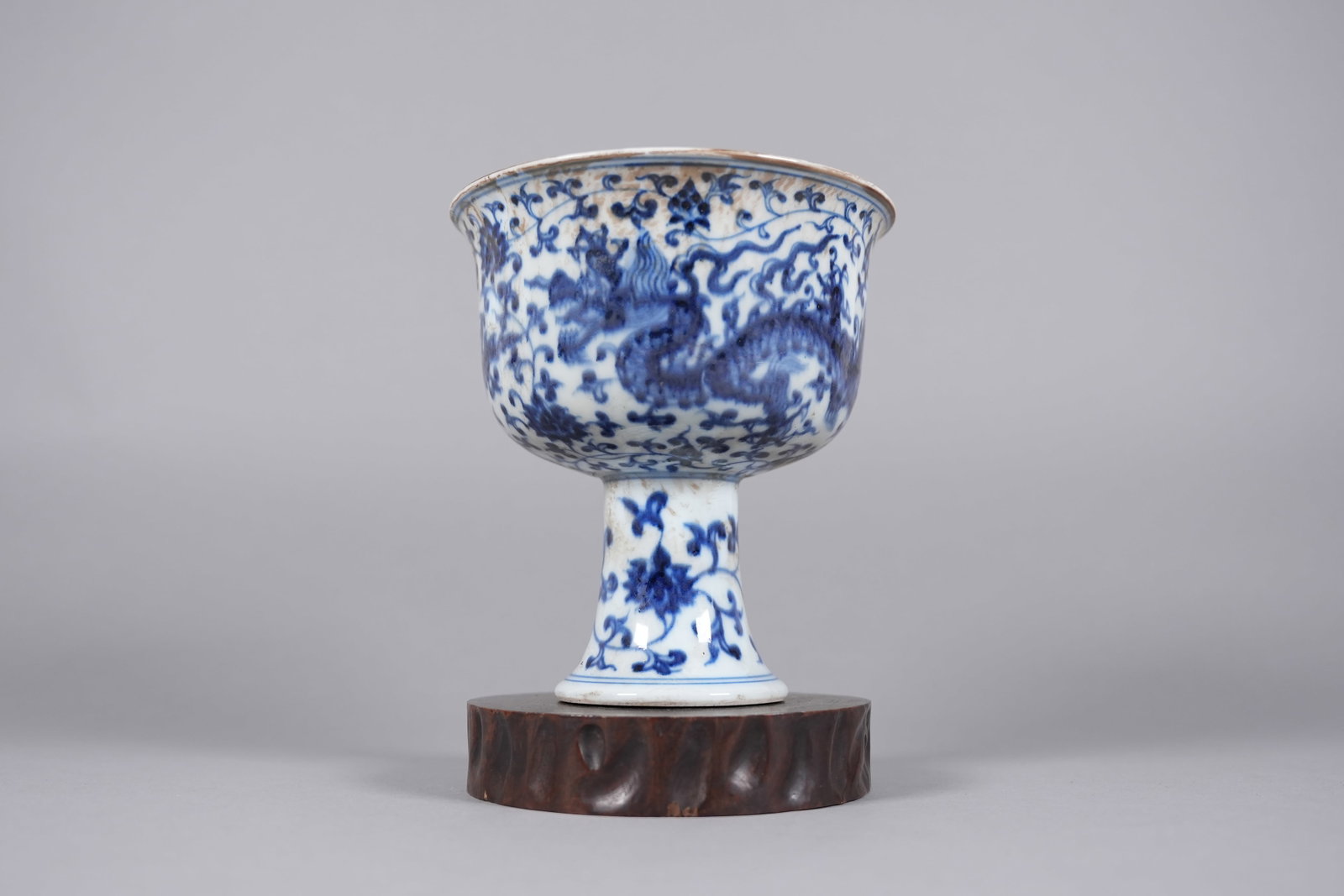 Chinese fine b/w dragon stem cup: Chinese fine blue and white dragon stem cup. H: 6.5" x W: 6."