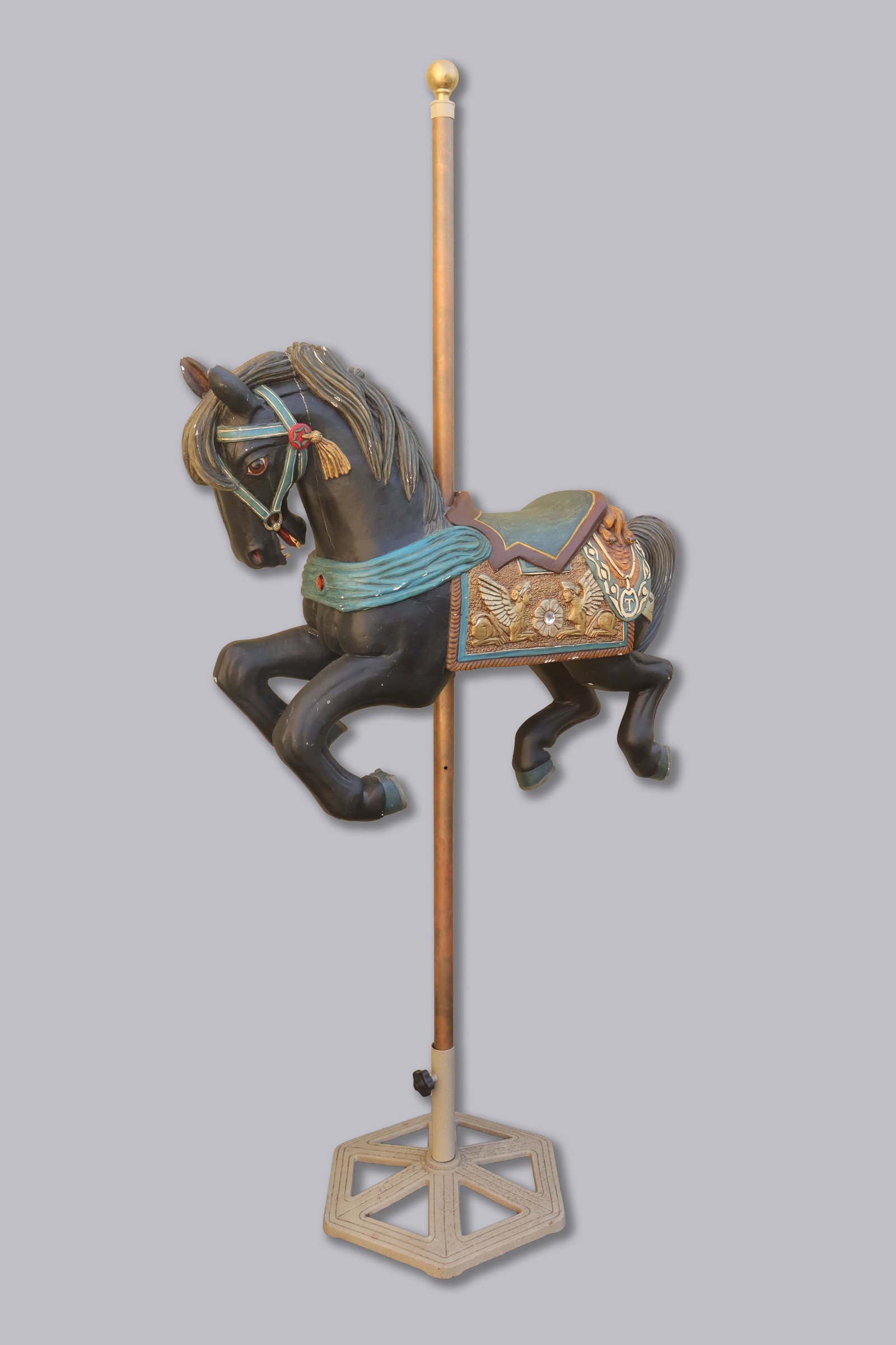 A vintage wooden horse carousel: A vintage wooden horse carousel. H: 85" x W: 40."