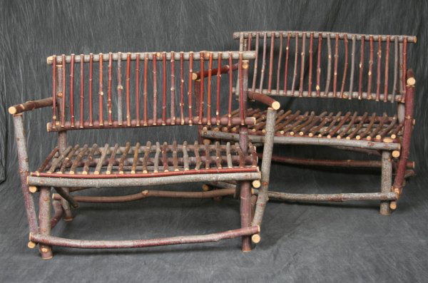 Pair Rustic Branch Settees: Each with rectangular back and seats raised over branch legs connected by "X" frame stretchers. 33"H. 45"W. 25"D. Condition: good.