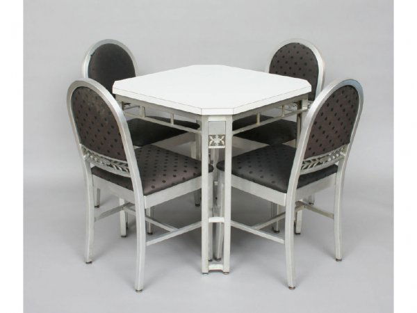 Goodform Art Deco Silver Grille Cleveland Suite: By Green and Probala for Goodform, cast in aluminum with floral accents, comprising a table and four chairs. Table 30 1/2"H. 29 1/2"W. 29 1/2"D. Chairs 35 1/2"H. 17 1/2"W. 16"D. Condition: table top r