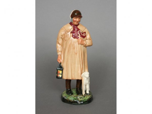 Royal Doulton The Shepherd HN1975: Royal Doulton, England, "The Shepherd", modeled as a shepherd and a lamb, painted in polychrome enamels, the base stamped with Royal Doulton company logo, HN 1975, with registration number, impressed