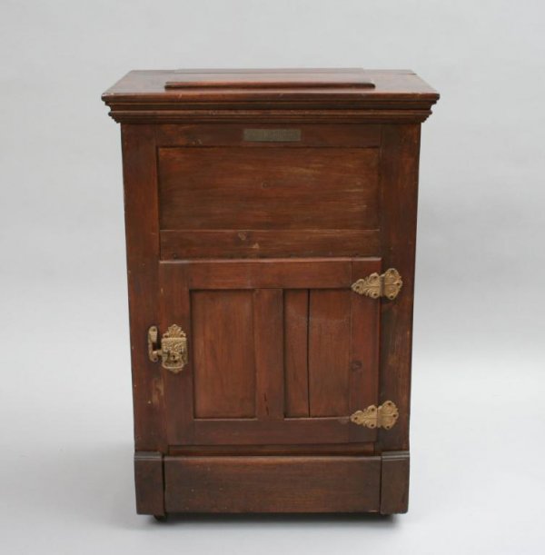 White Mountain Oak Ice Chest: Of squared form, fitted with a single door, with ornate hinges and door pull, lined. 41"H. 30 3/4"W. 20"D.