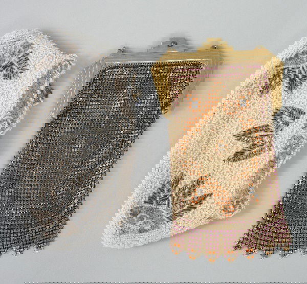 Antique Mesh Evening Bag: Comprising; an Art Deco era metal mesh evening bag decorated in a geometric motif, with metal frame and link handle, together with a vintage French beaded evening clutch. Mesh 6 3/4" x 4 1/4". Beaded