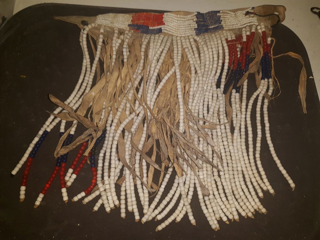 Native American Antique/Vintage Beaded Necklace: Native American Antique/Vintage Beaded Necklace seed beads,beads in white,range of reds, blue back/blue,orange,off white,on leather see pics condition is good expected loss for age 14 1/2" leather wid
