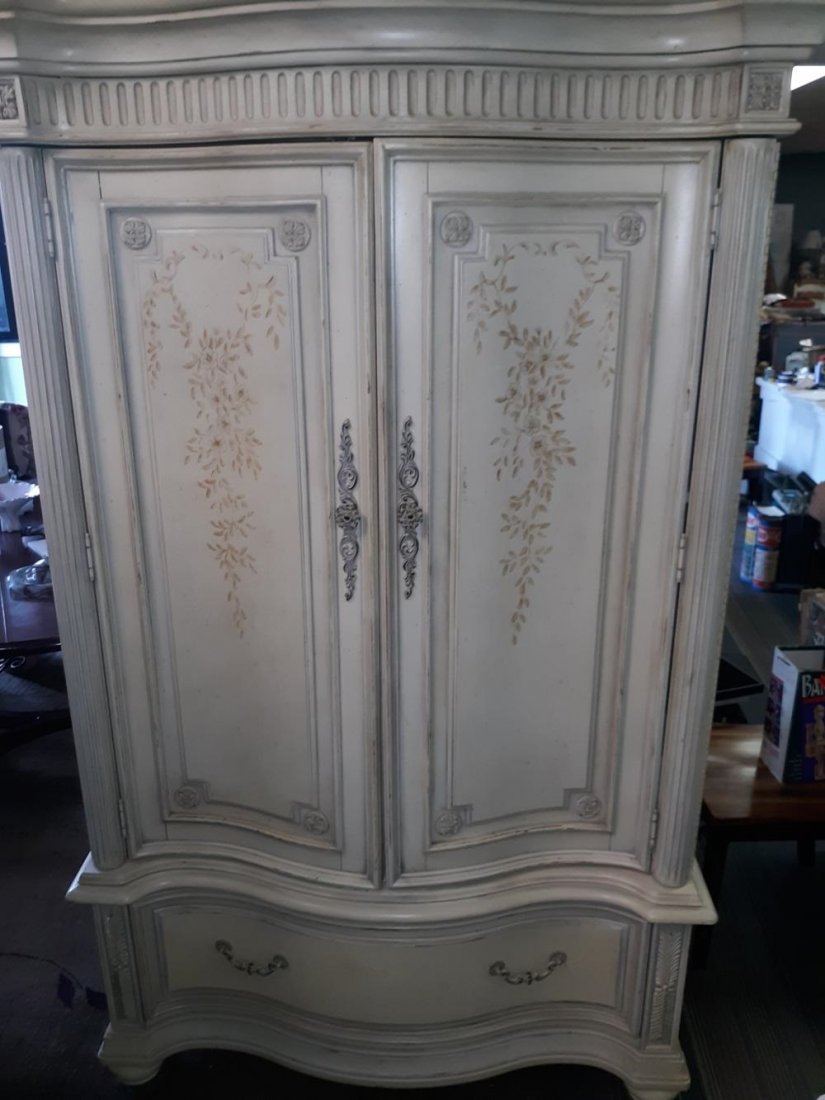 linen press armoire cabinet w/ floral design: linen press armoire cabinet w/ floral design 79 1/2" tall 24" deep 46" wide has 2 doors with 1 shelf and 2 drawers inside and one large drawer on bottom in very good condition see pics