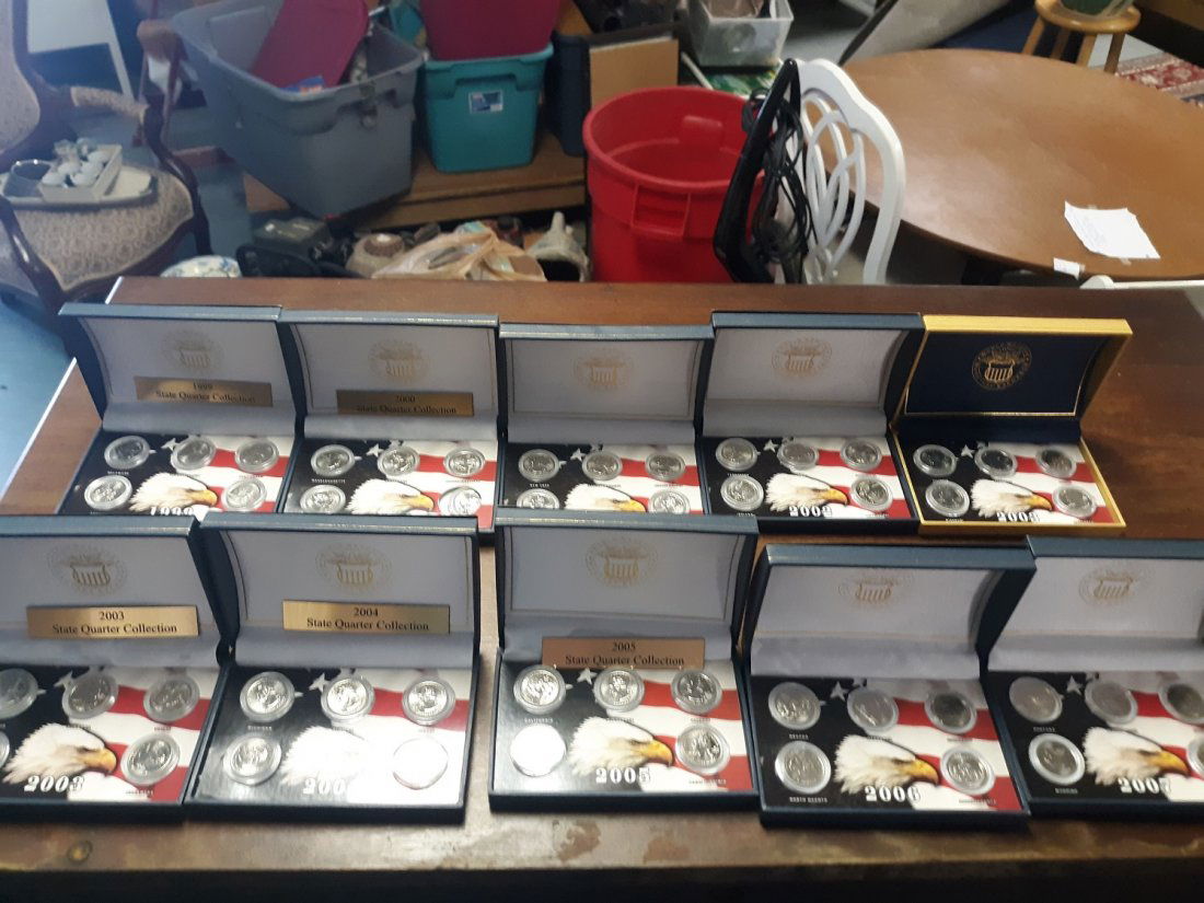 State Quarter Collection 10 Boxes 99-07: 10 boxes of state quarters from 1999 to 2007 1 of each year from 1999 with 5 quarters in each there is 2003 1 from each of the there years quarters in great condition boxes are a little rough need fla