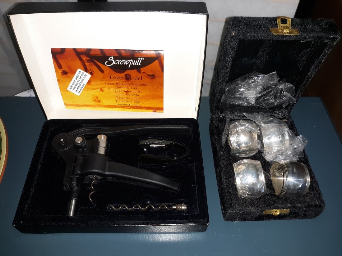 le creuset lever model wine opener & silver napkin ring: brand new le creuset wine opener in box with directions and 4 beautiful silver napkin rings by int silverplate all pictured for 1 bid! see pics
