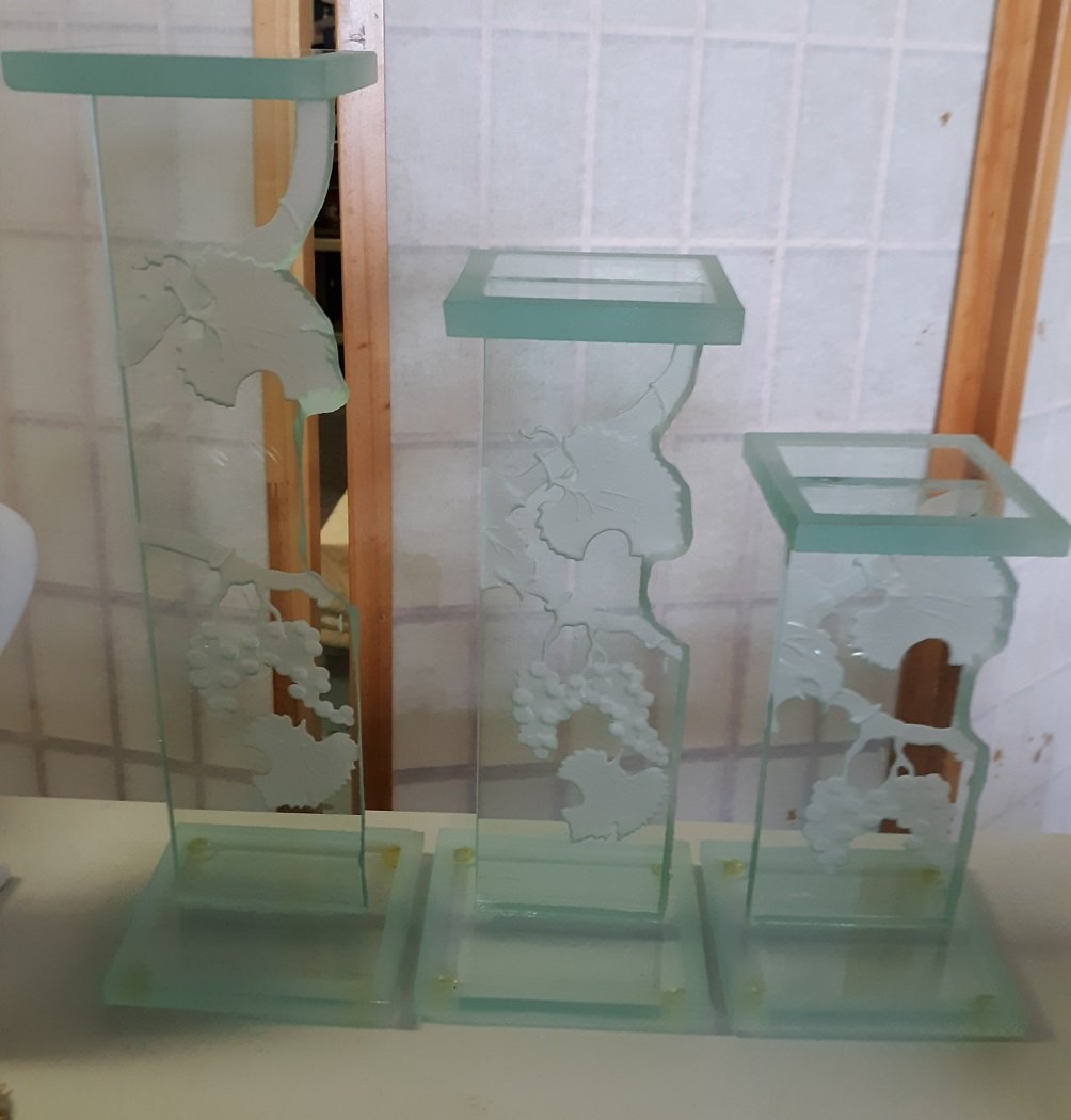 Oleg Cassini etched glass Pillar set of 3: gorgeous graduated glass pillar set 9 1/2" 12 1/2" 15 1/2" height 4" x 4" top etched grape pattern couple teeny flea bites but displays beautiful signed see pics