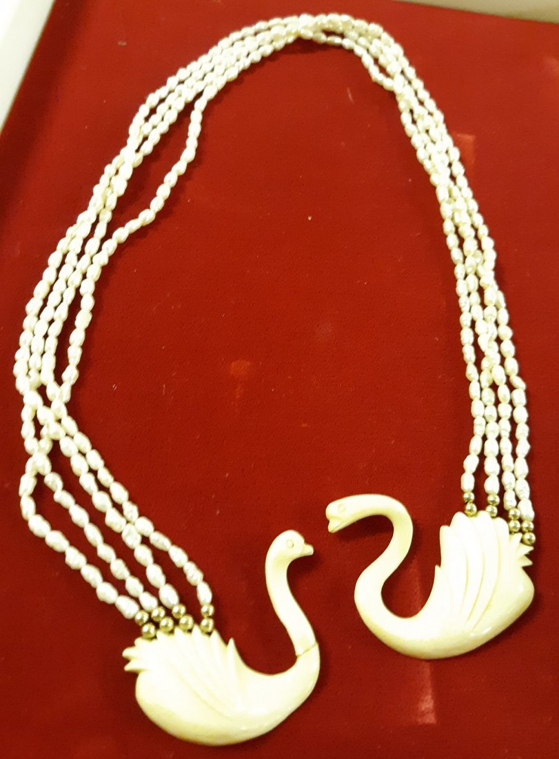Mid Century Seed Pearl & Carved Swans Shawl clip: high end mid century seed pearl gold beads and white carved swans closure 1 swan neck has a vintage repair these are for your sweater or shawl but what a rare find 18" see pics