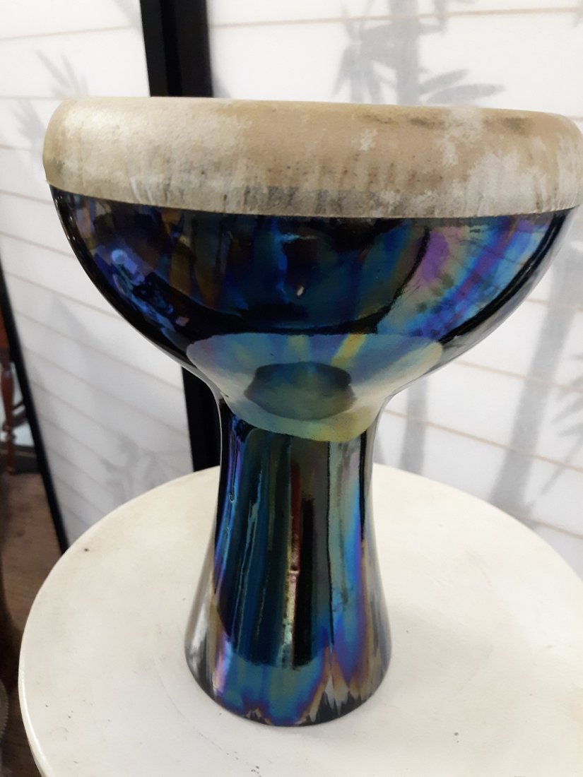 rare Goblet Drum by Noomoon!: very rare goblet drum by the now extinct nooman Tribe! gorgeous pottery base and skin headand great color and VGC 9 1/2" tall 7" across top has hairline but sounds fine see pics