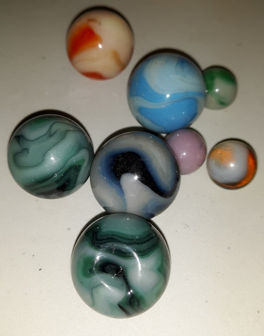 Glowie Uranium Estate Marbles hand made too lot of 8: beautiful estate marbles 5/8" -1" ++ all glow in black light some have a big pontil I believe they are all handmade see pics