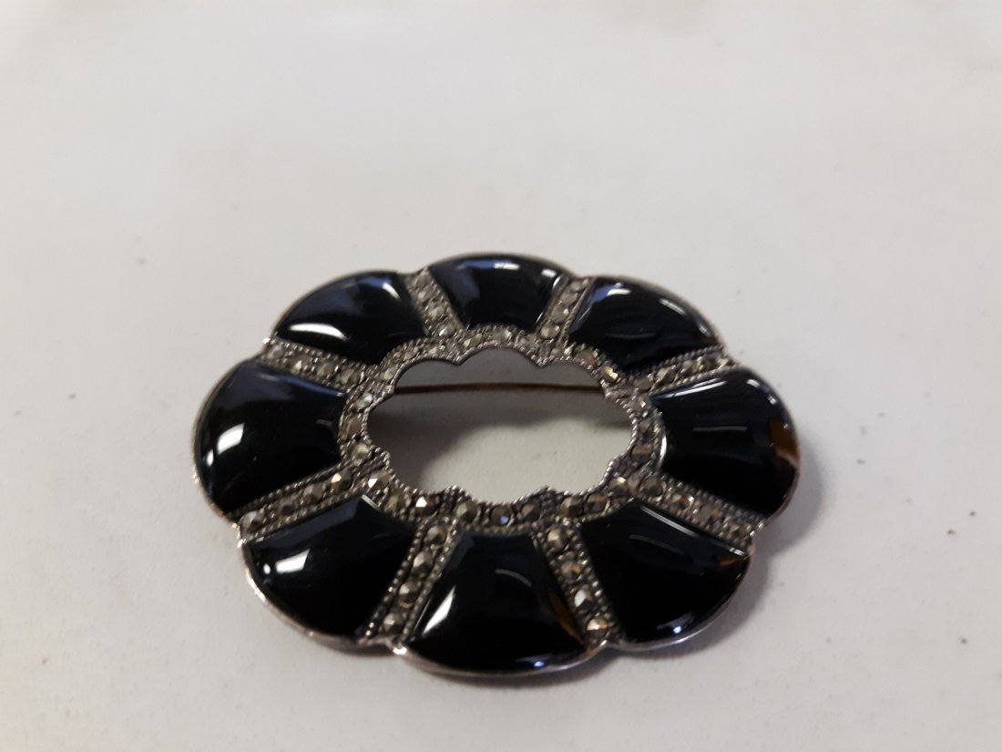 Art Deco Sterling,onyx and marcasite Brooch Vintage: beautiful sterling brooch with onyx and marcasites i do see 1 missing marcasite but gorgeous 2 1/2: x 1 3/4" see pics