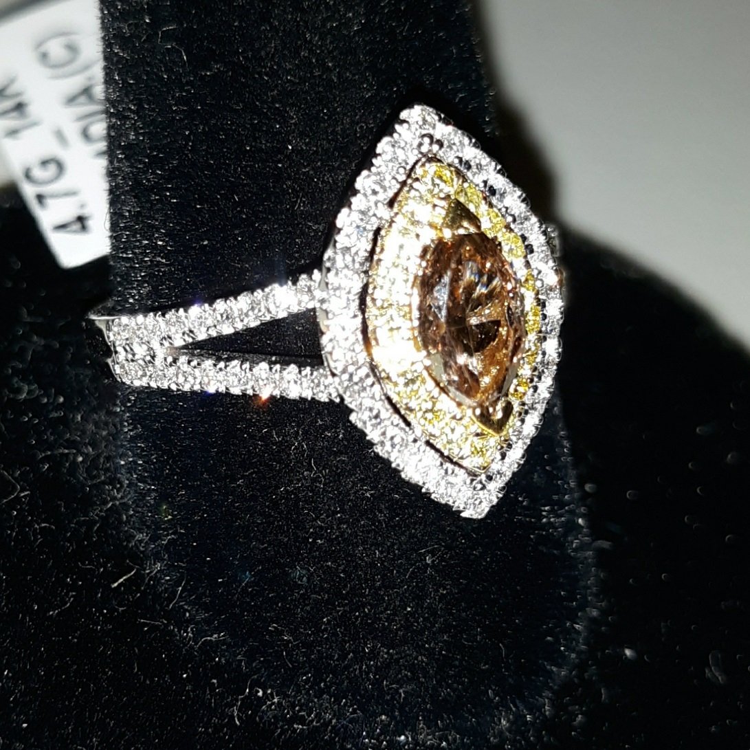 14k & Rare natural fancy colored diamond ring app: gorgeous fancy colored natural diamonds not treated set in 14k white gold setting .54 carat cognac center diamond & .52 carat fancy yellow & white diamonds see pics ring appraisal $6065.00 also includ