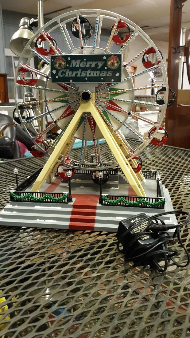 Carnival Ferris Wheel Music Box, Merry Christmas.: Carnival Ferris Wheel Music Box, Merry Christmas. plays music ferris wheel works merry christmas lights up condition is good 14 1/2" tall 13" wide see pics model #63043 music works