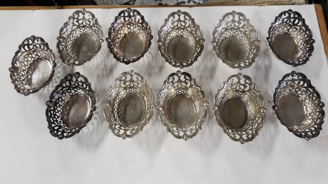 England Antique Silver plated EPNS salt cellars 11: England Antique Silver plated EPNS salt cellars 11 you have a total of 11 baskets salt cellars look in very good condition some are marked looks like a b with a cn inside the B and quadruple plate, EP